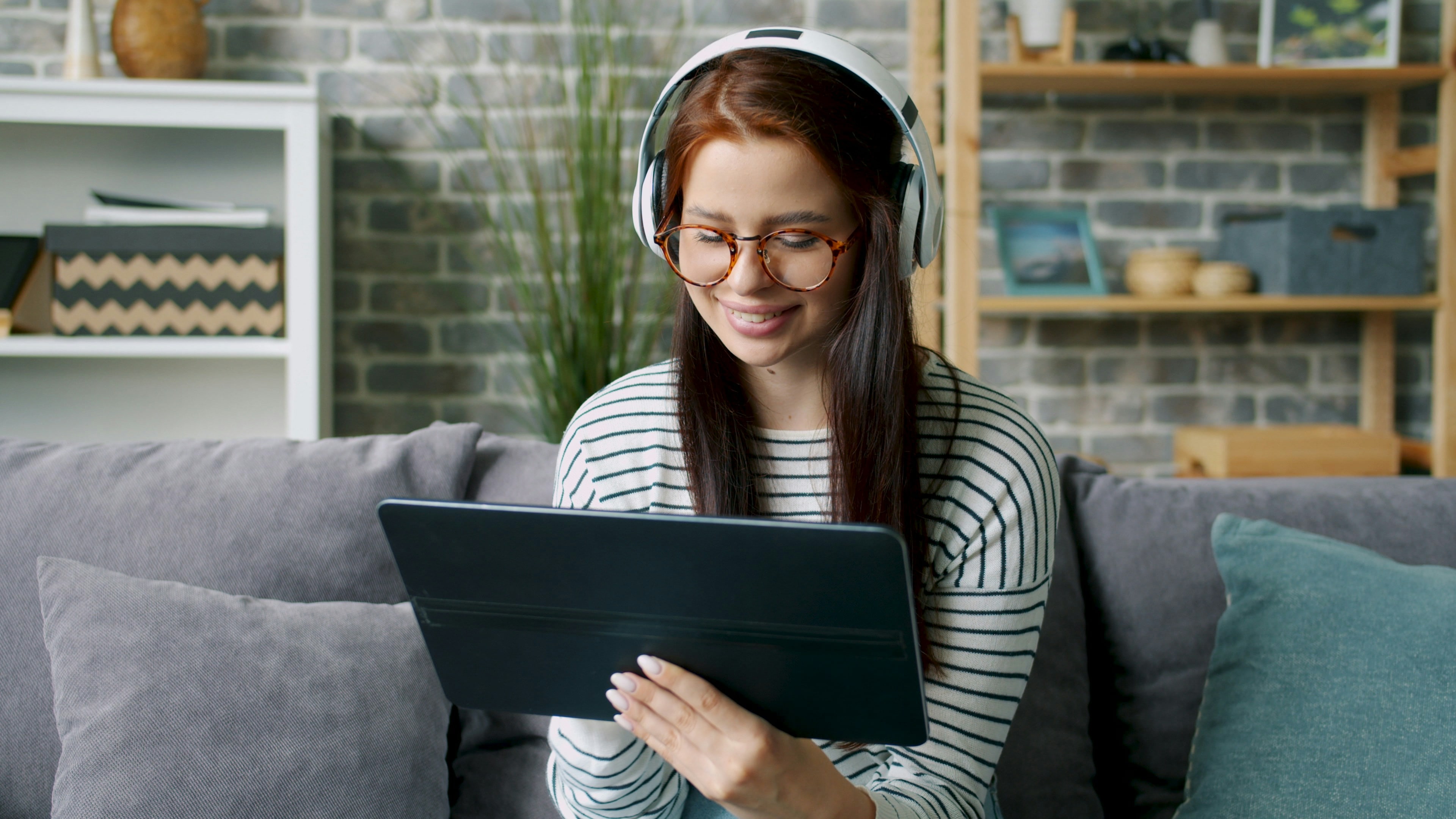 A person reviewing information on a tablet at home